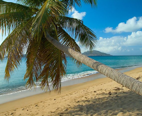 Nevis sits few miles and a world away from neighbouring St. Kitts, seen across The Narrows. Photo courtesy of Montpelier Plantation & Beach.